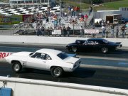 White 1969 Camaro Doing Wheelie